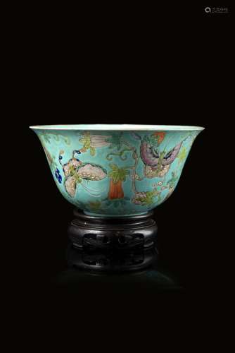 A turquoise-ground Famille Rose bowl decorated with butterflies amongst flowers and fruiting