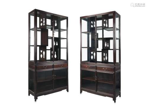 A pair of large black wood and glass display cabinetChina, early 19th centuryProvenancePurchased