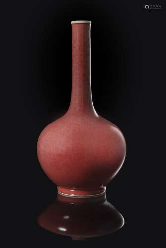 A monochrome red-glazed bottle vase with an apocryphal Qianlong to baseChina, 20th century(h 23.5