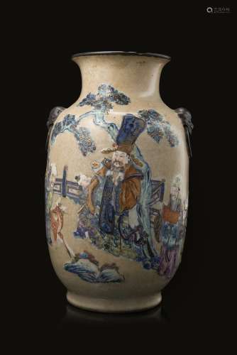A polychrome enamel vase decorated with blue and white Immortals with polychrome details on a cafè-