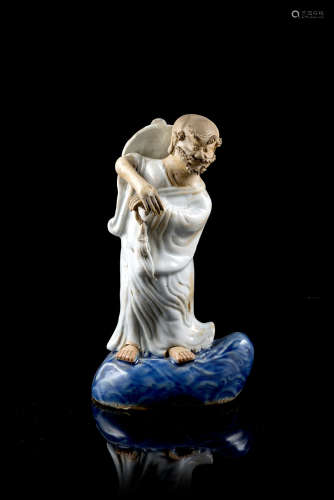 A biscuit model of a luohan standing on clouds (restorations)China, Qing dynasty, Qianlong period (