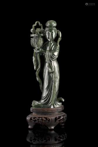 A spinach-green jade model of a lady wearing long robes, with wood baseChina, late 19th century(h.
