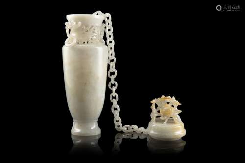 A pale jadeite twin-handled vase and cover with an internal chain, carved and pierced with floral