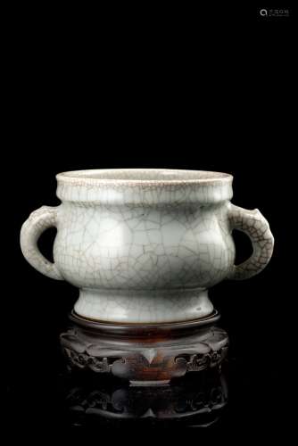 A twin handled-celadon glaze cup with a fine craquelure, wood baseChina, 20th century(d. max. 24