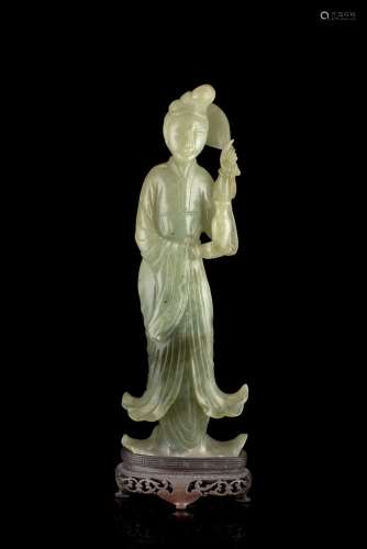 A celadon jade model of a lady wearing long robes, with wood baseChina, early 20th century(h. 22