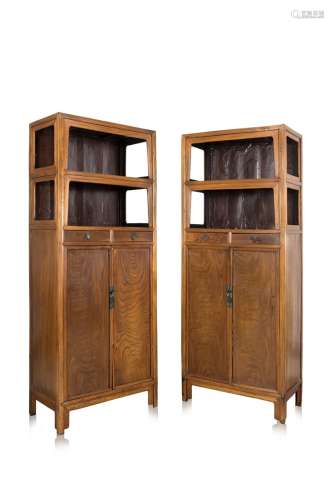 A pair of Chinese walnut (hetao) with two display shelves, two drawers and two doors with bronze