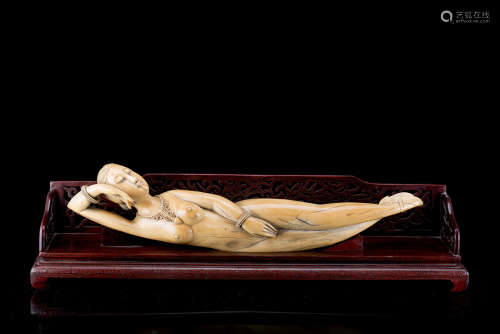 A large ivory model of a doctor's lady, wood base (defects)China, early 20th century(l. 63 cm.)