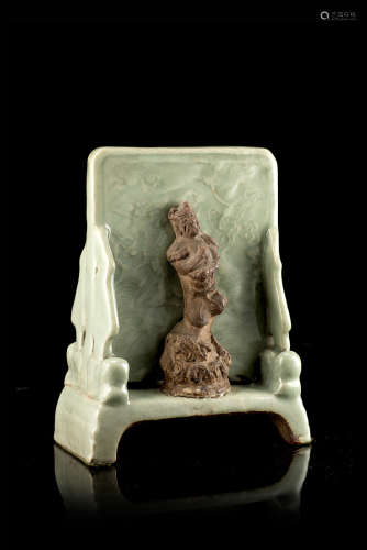 A celadon and bisquit table decorated with an ImmortalChina, Ming dynasty (1368-1644)(h. 17 cm.)