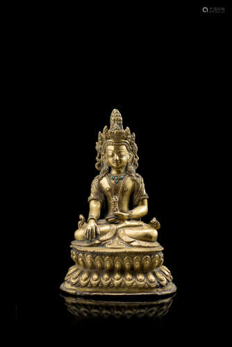 A gilt bronze figure of Buddha Akshobhya seated on a double lotus throne with his right hand in