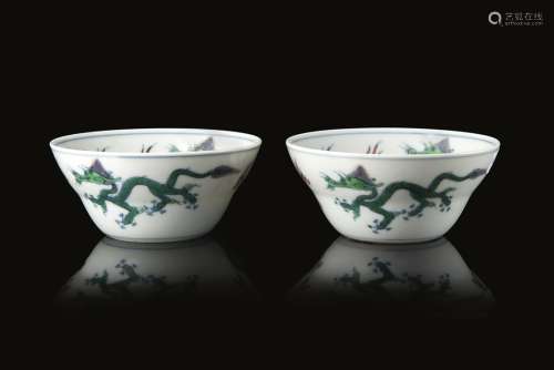 A pair of doucai porcelain cups decorated with pairs of dragons, an apocryphal Yongzheng mark to the