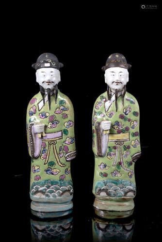 A pair of officials in biscuit decorated with polychrome enamels (defects)China, Qing dynasty,