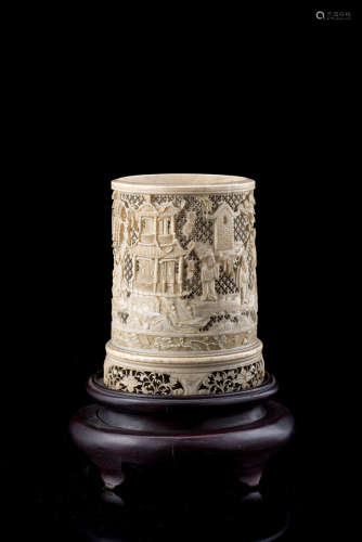 A carved and pierced ivory brush pot decorated with floral motifs, with wood baseChina, 19th