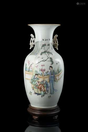 A twin-handled vase decorated in polychrome enamels with ladies and boys in a garden sceneChina,