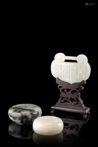 A pale celadon jade plaque, with inscription and two small circular boxes, with a wood baseChina,