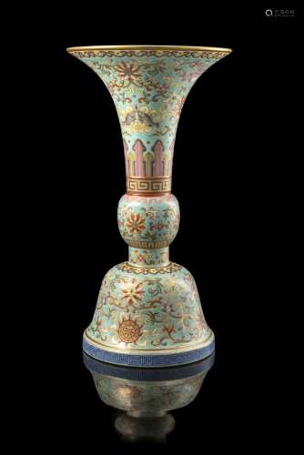 A turquoise-ground Famille Rose gu vase decorated with the Eight Buddhist Embelms bajixiang and