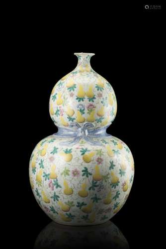 A Famille Rose double gourd vase decorated with double gourds, with apocryphal Qianlong mark to