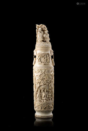 An ivory vase of archaistic form, with twin mask handles suspending rings (slight defects)China,