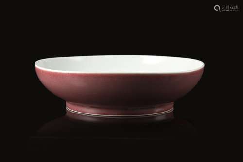 A peach-bloom glazed dish, the interior in white, with an apocryphal Chenghua mark to the base (