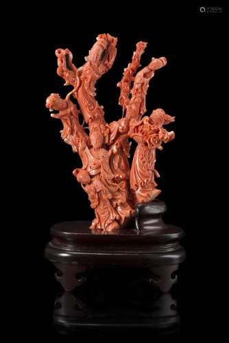 A red coral carving depicting ladies wearing long robes with flowering branches, wood baseChina,