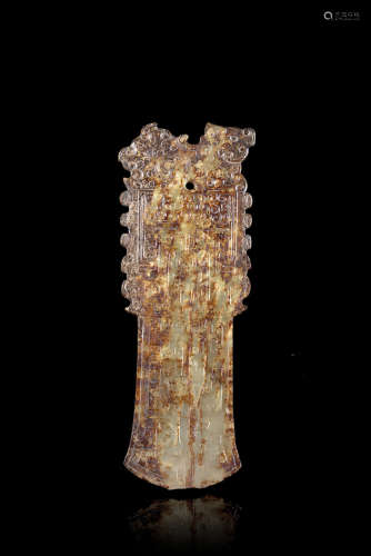 A celadon and russet jade ritual blade, of archaistic form, with incised geometric decorations and