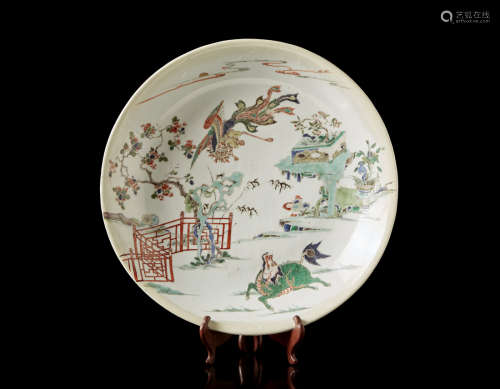 A Famille Verte porcelain dish decorated with a qilin, with wood support (defects and restorations)