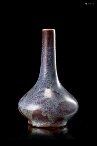 A flambè-glazed bottle vase, of squat form, of a vibrant purple tone (restorations)China, 18th