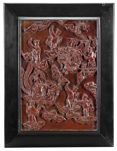 A carved and lacquered wood panel decorated with Immortals, framed China, 19th century(37x25 cm.)