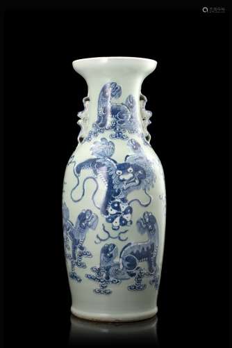 A celadon-ground baluster vase with twin lion handles decorated in blue and white with dragons (
