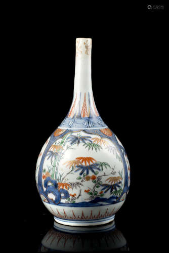 An Imari bottle vase decorated bamboo and flowering branches in reserve (restorations)Japan, 18th