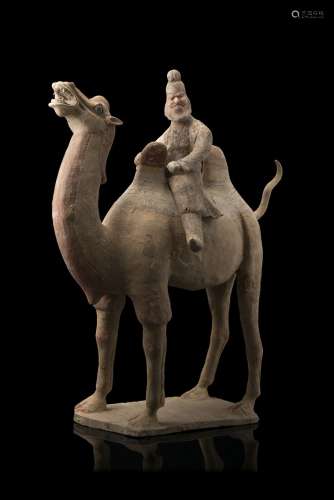 A painted pottery bactrian camel with sogdian rider, the beast standing on a base