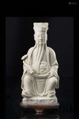 A Blanc-de-Chine model of an emperor, portrayed seated, with a ruyi sceptre, with wood baseChina,