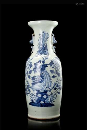 A celadon-ground baluster vase with twin lion handles, decorated in blue and white with phoenix