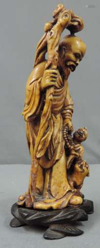 Stone figure. Probably saint or monk. Proably Japan Meiji period.