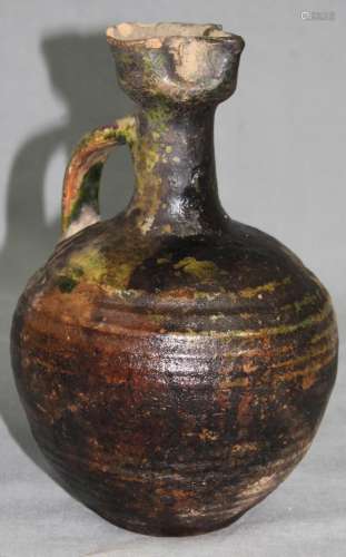 Earthenware jug. Black - green - glaze. China? Antique?