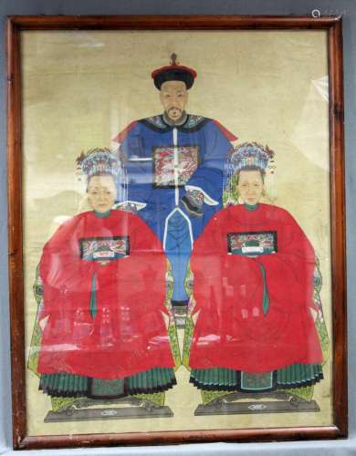 Ancestral portraits. A civil servant and two women. China.