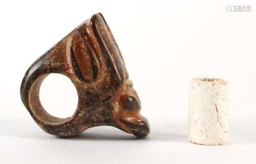 TWO 'RED HILL CULTURE' ARTIFACTS - First, a black and rust-colored zoomorphic stone carving with two holes, one between the ears and.