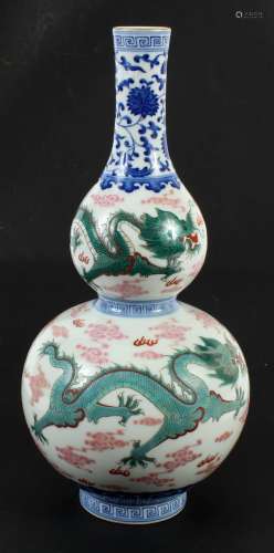 CHINESE PORCELAIN DOUBLE GOURD VASE - Showing red and green dragons vying for the flaming pearl amidst fire symbols and clouds.