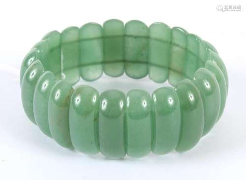 SPINACH GREEN JADE FLEXIBLE BRACELET - Strung on two parallel flexible cords, the 22 oval curved sections of highly polished and rel...