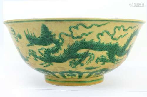 CHINESE PORCELAIN JAUNE BOWL - Large jaune bowl with two green dragons circling the exterior wall in pursuit of the flaming pearl. F...