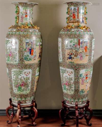 PAIR MONUMENTAL CHINESE FAMILLE ROSE PALACE VASES. - In the Cantonese style decorated with elaborate vignettes showing an exhibition...