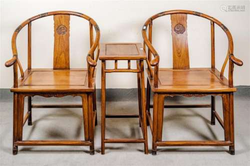 PAIR OF HUALI ARMCHAIRS AND TEA TABLE - Traditional Ox Bow armchairs carved of Chinese huali hardwood; each with bow-form top rail,...