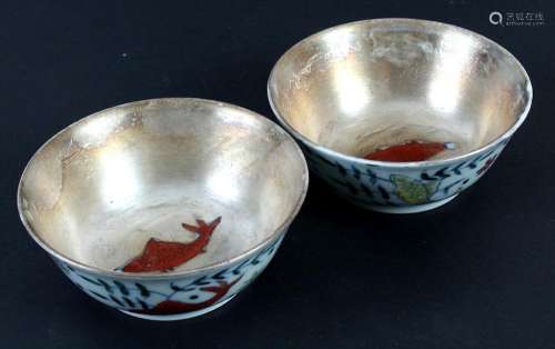 PAIR SMALL DOUCAI PORCELAIN BOWLS WITH SILVERED INTERIOR & BASES - Outer porcelain wall decorated with fish and aquatic vegetation....