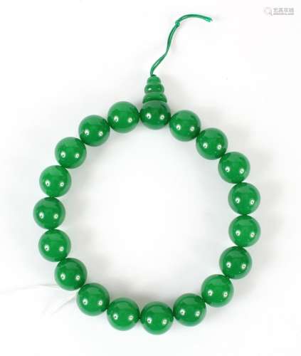 GREEN HARDSTONE MALA WRIST BEADS - Nineteen highly opaque, polished jade green beads 0.75