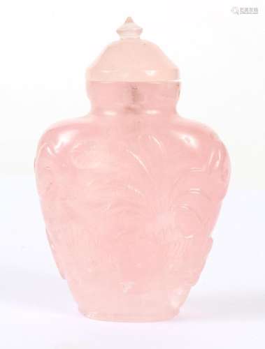 CHINESE ROSE QUARTZ SNUFF BOTTLE - Carved with a foliate motif; matching cap and bone spoon. Condition good; chip on base.