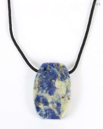 HARDSTONE CARVED PENDANT ON CORD - The polished lapis blue and pale celadon color hardstone is carved into a rounded rectangular pen...