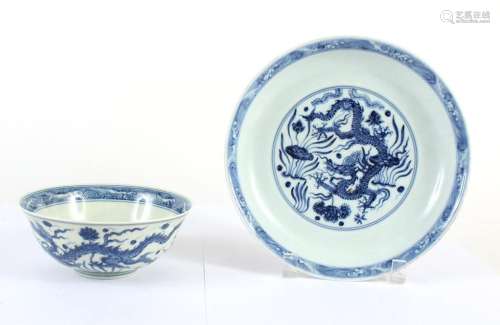 TWO B/W CHINESE PORCELAIN PIECES; BOWL & PLATE - Both decorated with dragons, foliate scroll, lotus flowers and pods. Character sign...