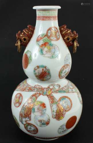 DOUBLE GOURD CHINESE VASE WITH GROTESQUE MASK HANDLES - Porcelain. Faux mask handles with stationary rings; rondel pattern overall a...