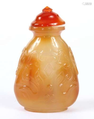 CARVED AGATE SNUFF BOTTLE - With abstract design; matching cap, bone spoon. Unsigned. Good condition. Mid 20th century. 2.5