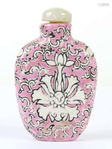 CHINESE PORCELAIN SNUFF BOTTLE WITH JADEITE CAP - Pink ground with white flowers and foliate scroll. Jadeite cap and bone spoon. Unm...