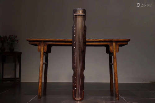 A TONGMU WOOD ZITHER MUSICAL INSTRUMENT